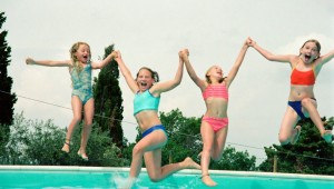 Girls playing at the pool